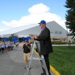 John Martin cheers on Fred Antczak directing from a ladder